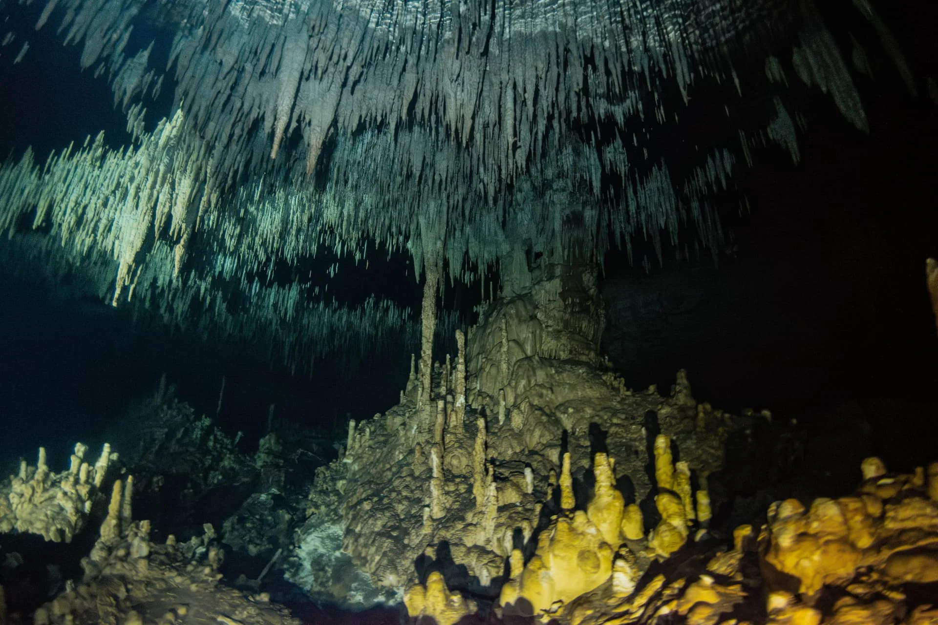 Large limestone columns and dense pointed formations inside Dreamgate