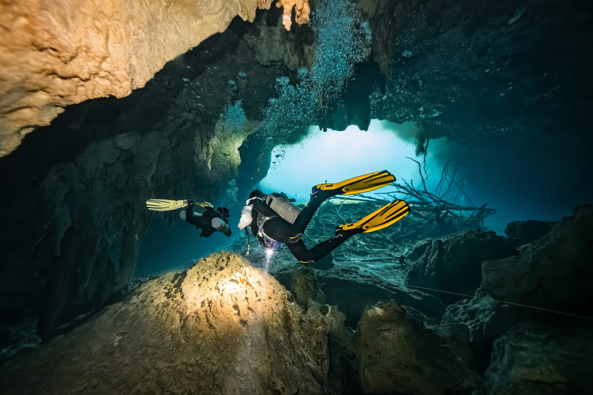 Rubiel Estrada with divers getting ready in the water before a cenote dive in Tulum
